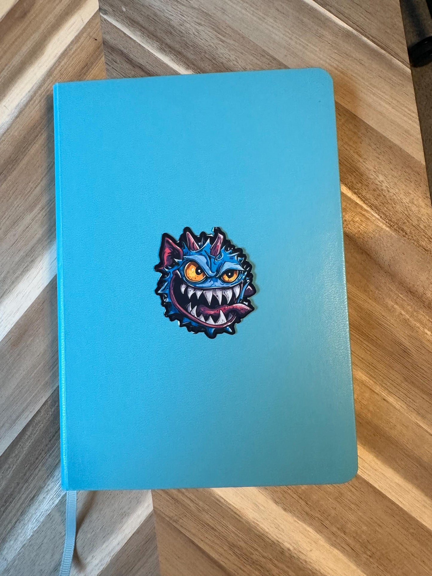 Blue Spike Monster Vinyl Sticker: Mischievous Gaming Character Art